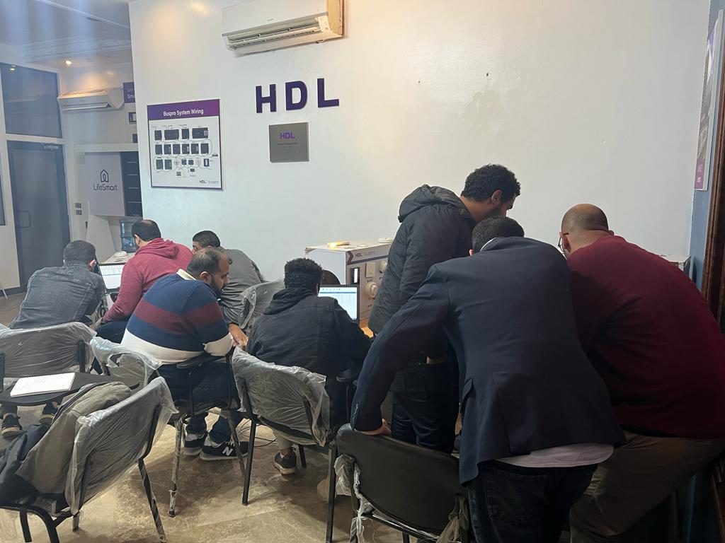 Trainees programming the devices with the trainer