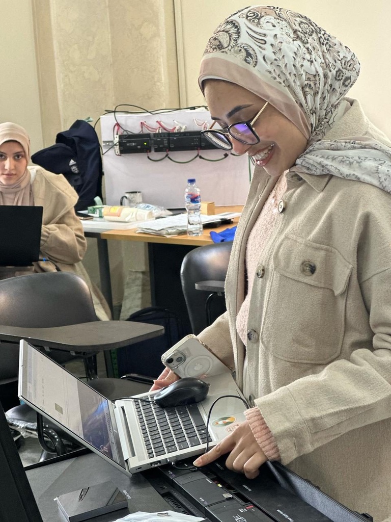 A trainee commissioning the devices from her laptop